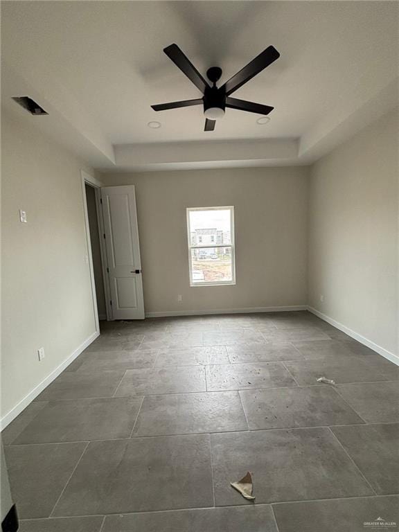 2213 Dorado Dr, Mission, TX 78573 - empty room with a raised ceiling and ceiling fan