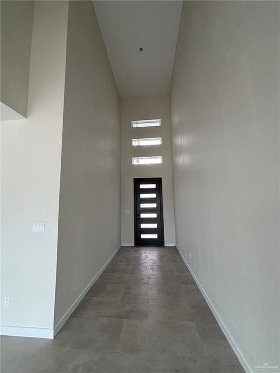 2213 Dorado Dr, Mission, TX 78573 - doorway with a high ceiling and baseboards