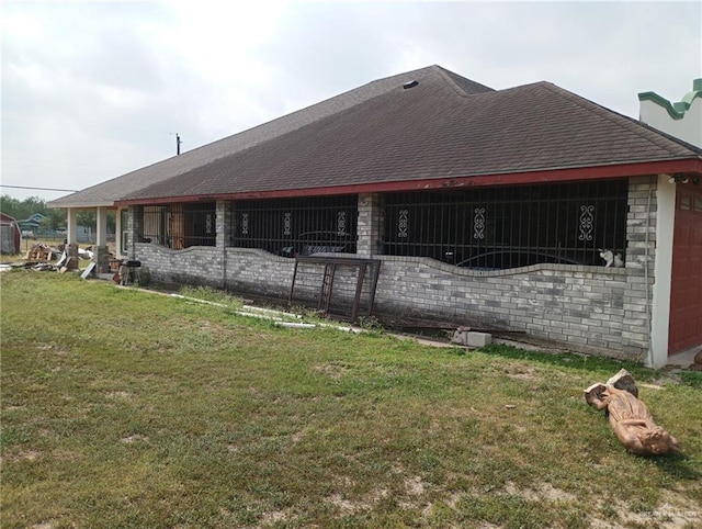 1020 S Georgia Ave, Mercedes, TX 78570 - view of side of property with a lawn and an attached garage