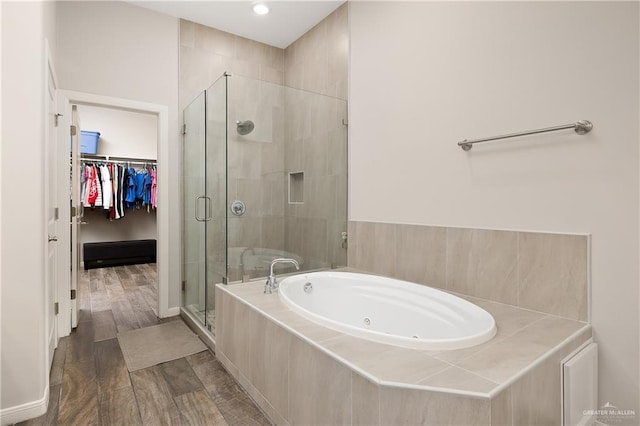 bathroom with shower with separate bathtub