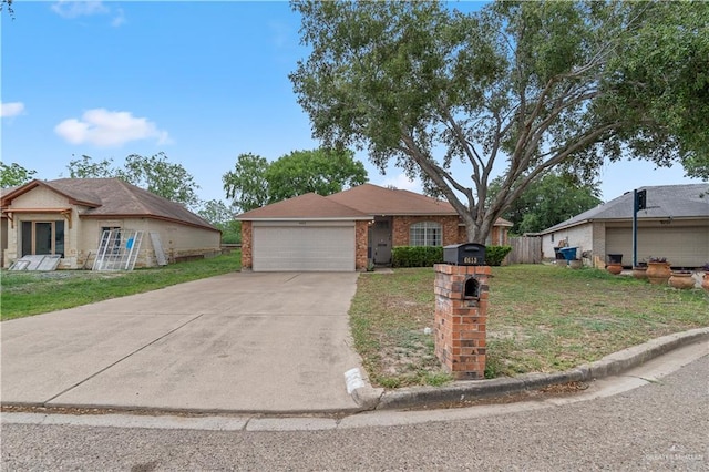 view of front of property featuring brick siding, a front lawn, driveway, and an attached garage