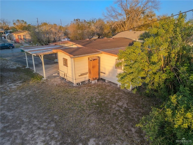 view of outbuilding with a carport