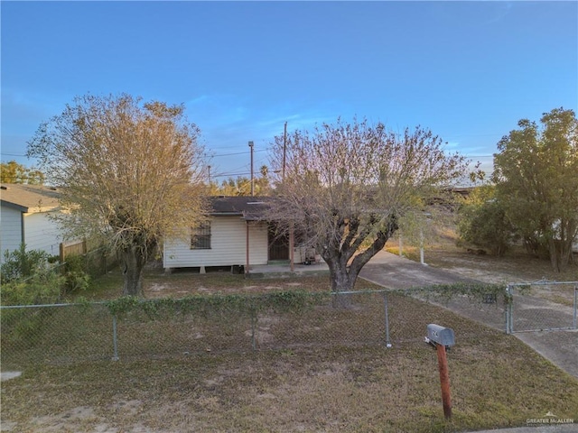 view of front of property with fence and a gate