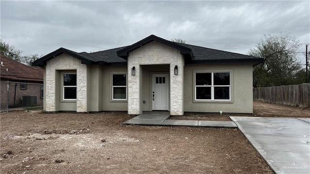 view of front of home featuring central air condition unit