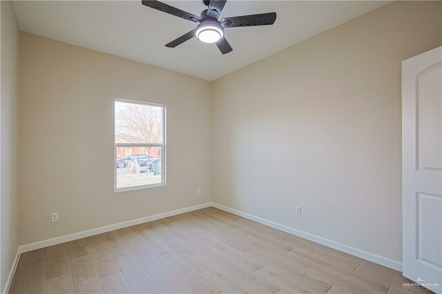 empty room with light hardwood / wood-style floors and ceiling fan