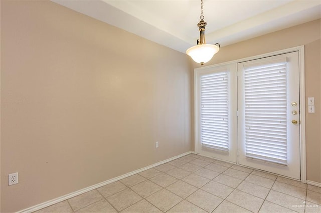 unfurnished room featuring light tile patterned flooring