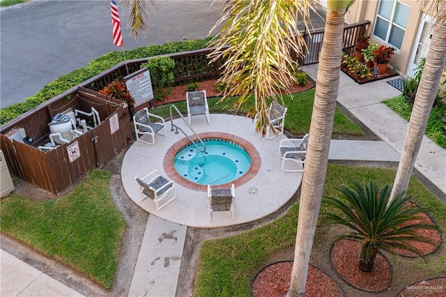 view of swimming pool with a community hot tub