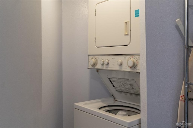 washroom with stacked washer and clothes dryer