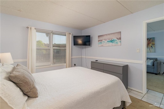 bedroom featuring light tile patterned floors