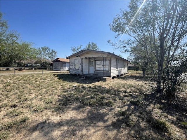 view of property exterior featuring fence