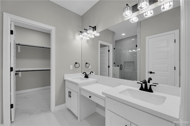 bathroom featuring vanity and a shower with shower door