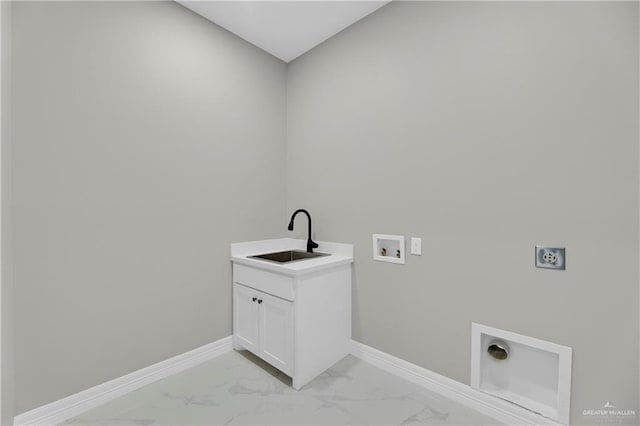 clothes washing area featuring hookup for an electric dryer, cabinets, sink, and hookup for a washing machine