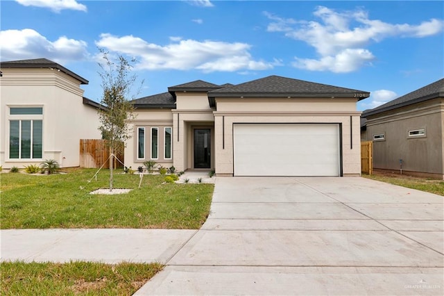 prairie-style home with a garage and a front yard