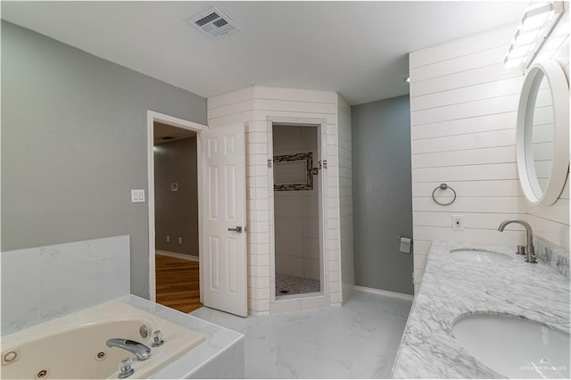 2201 Ascot Dr, Edinburg, TX 78542 - bathroom featuring a jetted tub, a stall shower, double vanity, baseboards, and marble finish floors