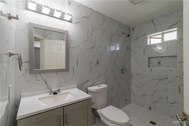 2201 Ascot Dr, Edinburg, TX 78542 - bathroom featuring vanity, toilet, walk in shower, and tile walls