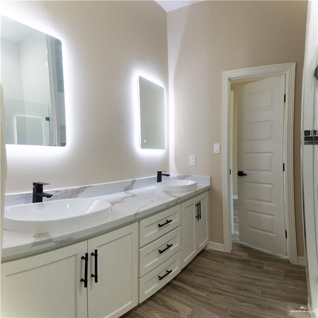 bathroom featuring wood-type flooring and vanity