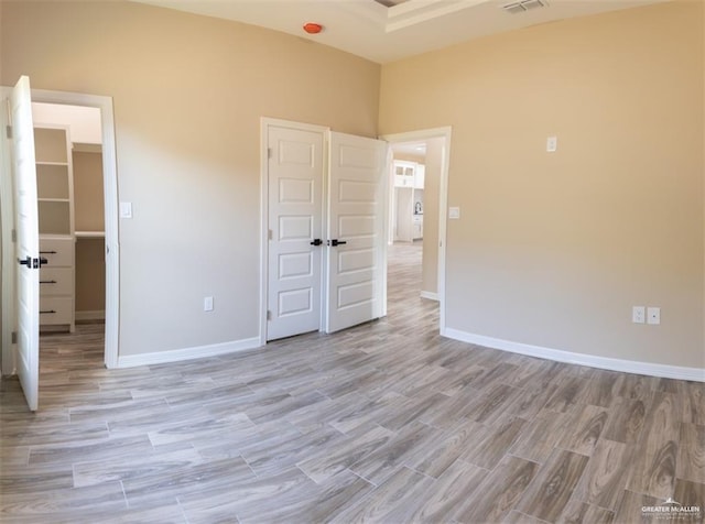 unfurnished bedroom with light hardwood / wood-style flooring