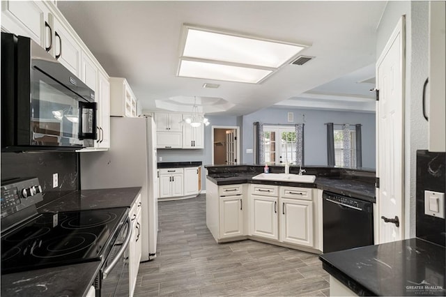 1608 Merlin Dr, Mission, TX 78572 - kitchen featuring black appliances, a sink, a chandelier, and white cabinetry