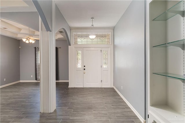 1608 Merlin Dr, Mission, TX 78572 - foyer entrance featuring arched walkways, wood finished floors, ceiling fan, and baseboards