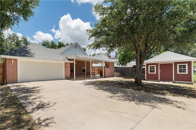 view of front of home featuring a storage unit