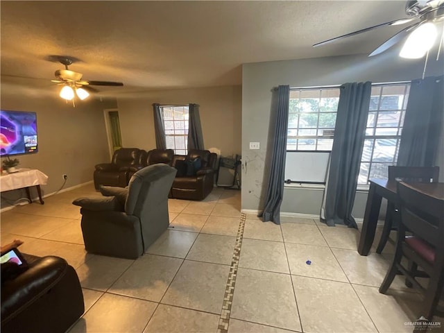 3020 Nickel Ave, Mission, TX 78574 - living area with a ceiling fan, light tile patterned flooring, baseboards, and a textured ceiling