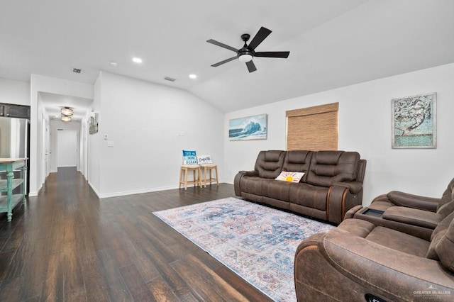 living room featuring ceiling fan, vaulted ceiling, and dark hardwood / wood-style flooring