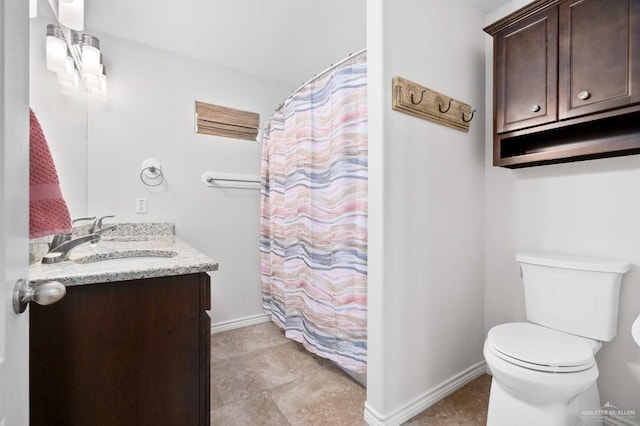 bathroom with vanity, toilet, and a shower with shower curtain