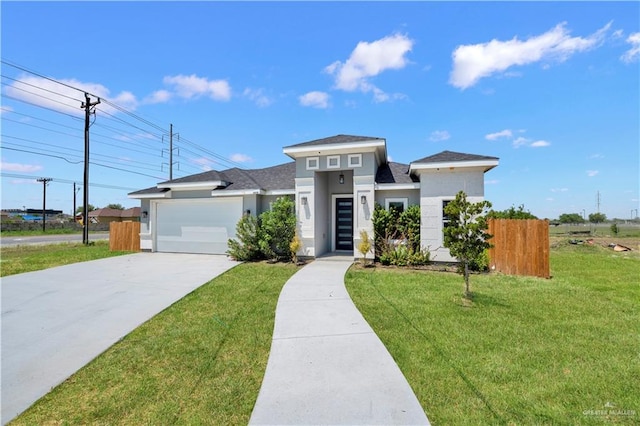 2820 Linva Ave, Mcallen, TX 78541 - prairie-style home featuring driveway, fence, a front yard, stucco siding, and a garage