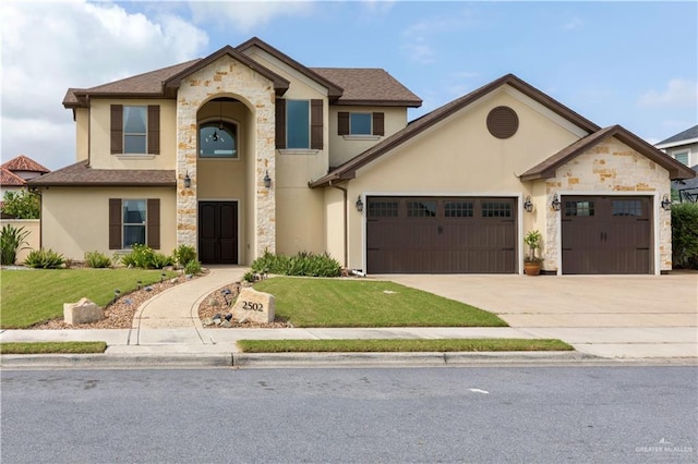 2502 Elbrus Ave, Edinburg, TX 78539 - view of front of house featuring stone siding, stucco siding, an attached garage, a front yard, and concrete driveway