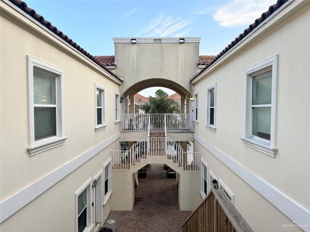 102 E Gardenia St Unit 8, South Padre Island, TX 78597 - view of patio / terrace with stairway
