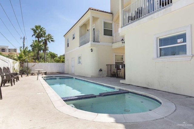 102 E Gardenia St Unit 8, South Padre Island, TX 78597 - view of pool with a fenced backyard, a pool with connected hot tub, and a patio area