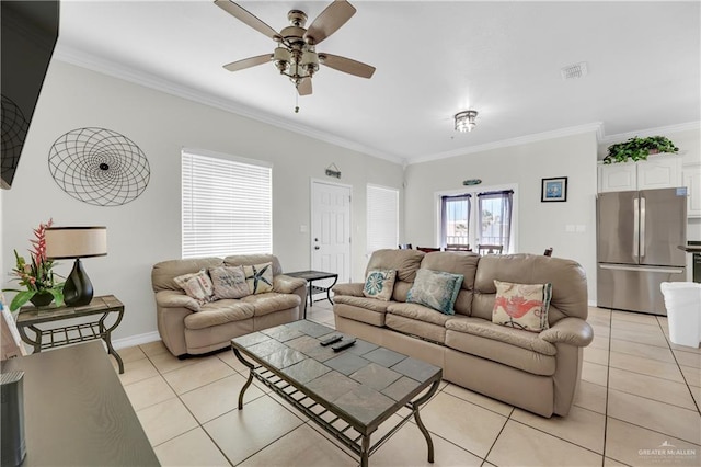 tiled living room featuring ceiling fan, french doors, and ornamental molding