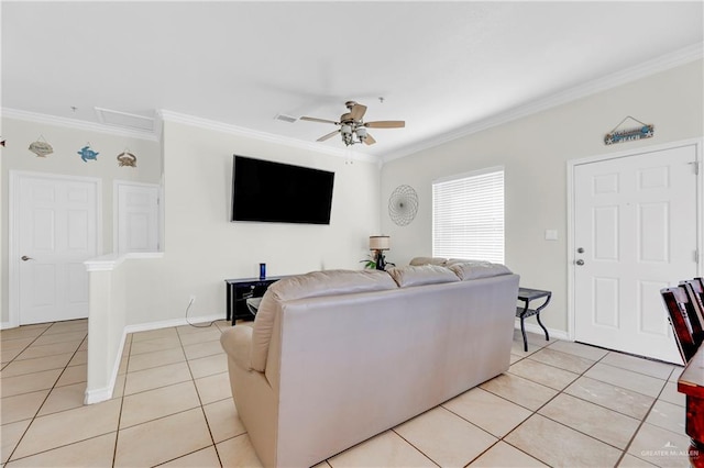 tiled living room featuring ceiling fan and crown molding