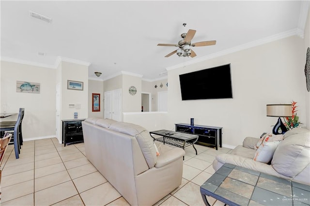 tiled living room with ceiling fan and ornamental molding