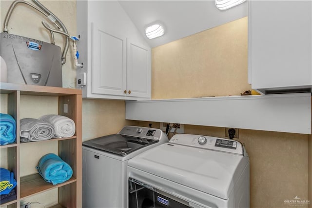 310A Padre Blvd Unit 3101, South Padre Island, TX 78597 - washroom featuring cabinet space and washer and clothes dryer
