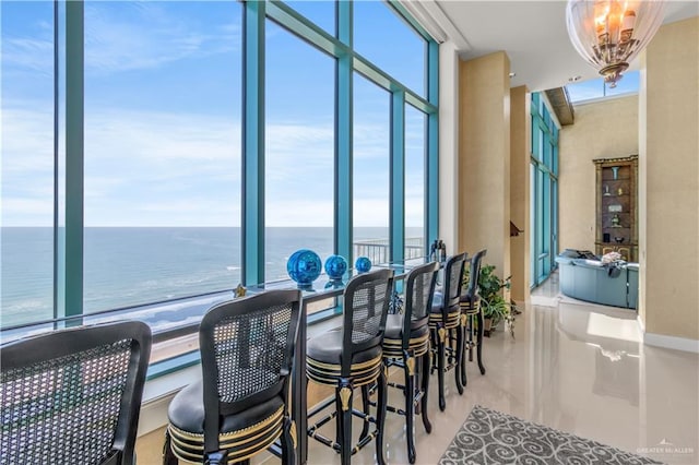 310A Padre Blvd Unit 3101, South Padre Island, TX 78597 - dining area with a water view and a chandelier