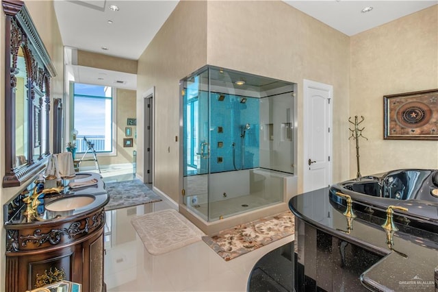 310A Padre Blvd Unit 3101, South Padre Island, TX 78597 - bathroom with a stall shower, vanity, a jetted tub, and recessed lighting
