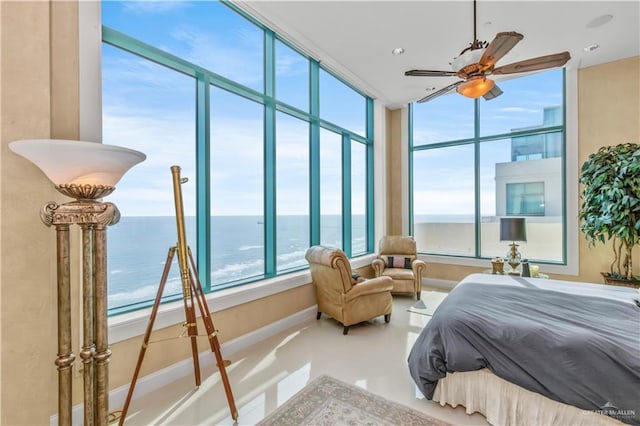 310A Padre Blvd Unit 3101, South Padre Island, TX 78597 - bedroom with a water view, finished concrete floors, and a ceiling fan