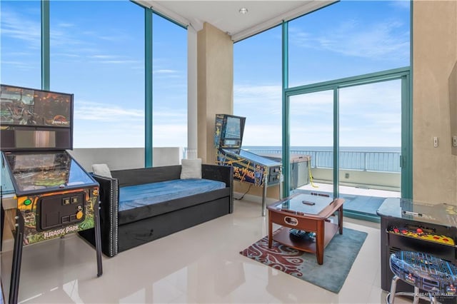 310A Padre Blvd Unit 3101, South Padre Island, TX 78597 - living room featuring a wall of windows, a water view, and tile patterned floors
