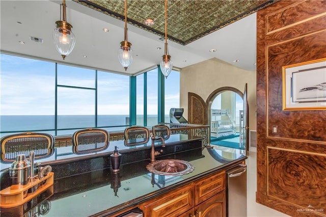 310A Padre Blvd Unit 3101, South Padre Island, TX 78597 - kitchen with dark countertops, decorative light fixtures, an ornate ceiling, and plenty of natural light