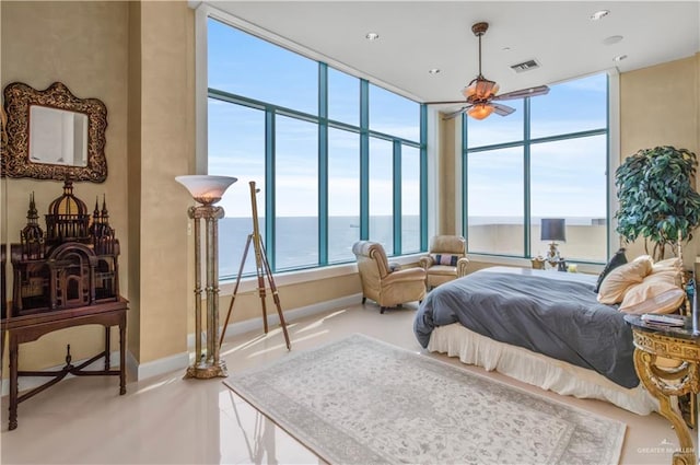 310A Padre Blvd Unit 3101, South Padre Island, TX 78597 - bedroom featuring a water view, multiple windows, and expansive windows