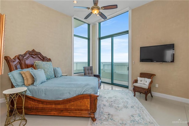 310A Padre Blvd Unit 3101, South Padre Island, TX 78597 - bedroom with a wall of windows, access to exterior, and ceiling fan