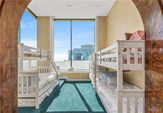 310A Padre Blvd Unit 3101, South Padre Island, TX 78597 - carpeted bedroom featuring multiple windows and arched walkways