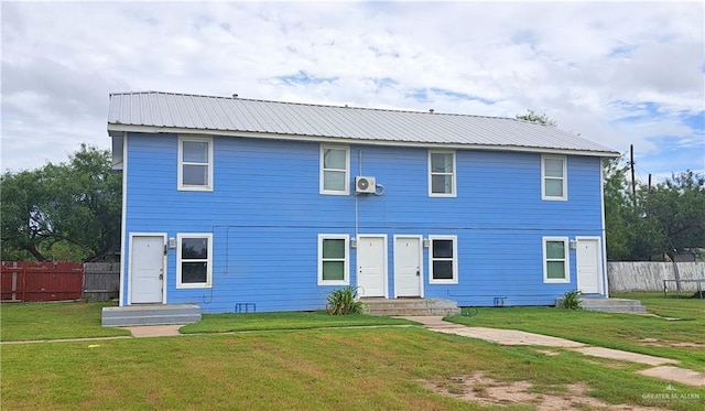 1217 S 1st St, Harlingen, TX 78550 - rear view of property featuring a metal roof