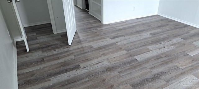 1217 S 1st St, Harlingen, TX 78550 - detailed view of wood finished floors and baseboards