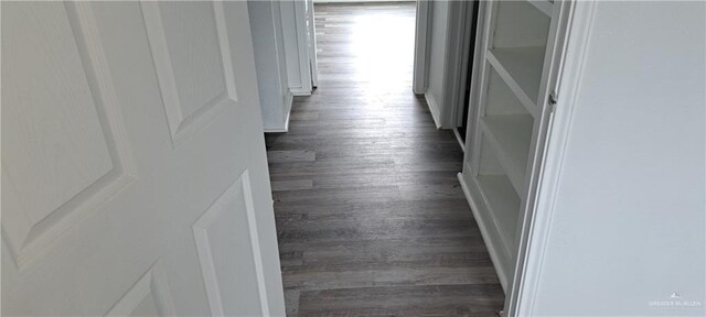 1217 S 1st St, Harlingen, TX 78550 - hallway featuring dark wood-style flooring