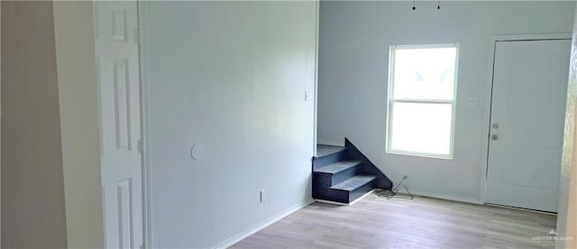 1217 S 1st St, Harlingen, TX 78550 - entrance foyer with baseboards and light wood finished floors