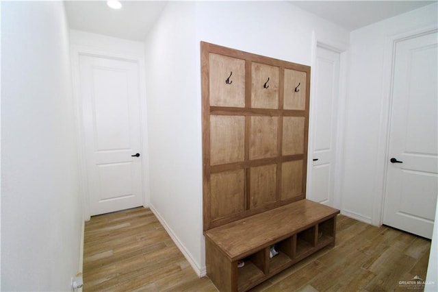 mudroom with light hardwood / wood-style flooring