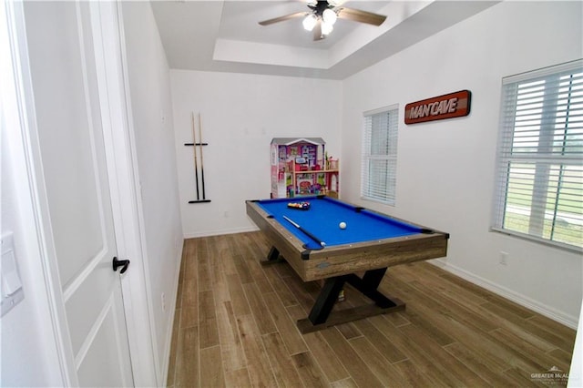 recreation room with hardwood / wood-style flooring, ceiling fan, a tray ceiling, and billiards