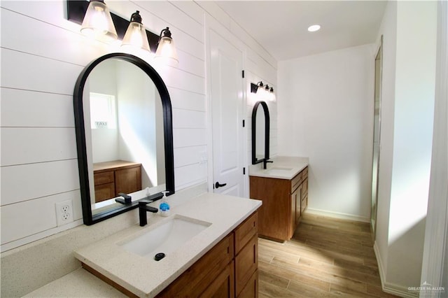 bathroom with vanity and wood-type flooring